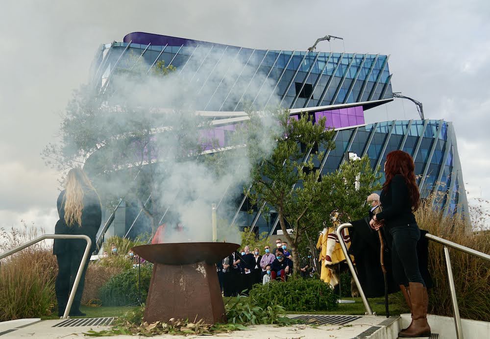 A smoking ceremony with people watching